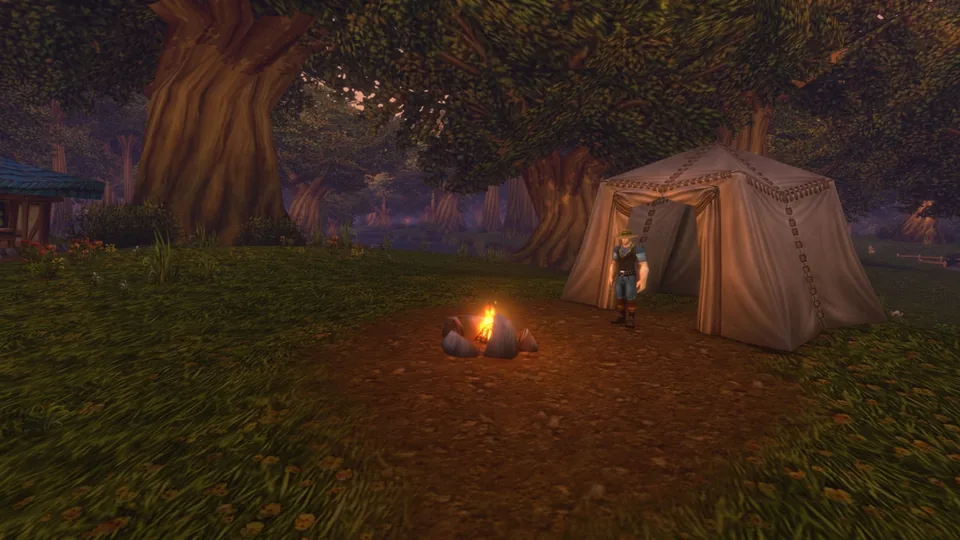 A campfire and a tent under large trees, with a character standing by the tent, in World of Warcraft: Forever